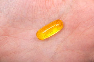 Nutrition. Healthy Lifestyle. Woman Holding Capsule With Fish Oil Omega-3. Supplements, Vitamins.