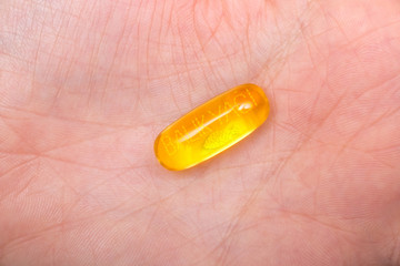 Nutrition. Healthy Lifestyle. Woman Holding Capsule With Fish Oil Omega-3. Supplements, Vitamins.