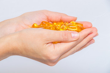 Nutrition. Healthy Lifestyle. Woman Holding Capsule With Fish Oil Omega-3. Supplements, Vitamins.