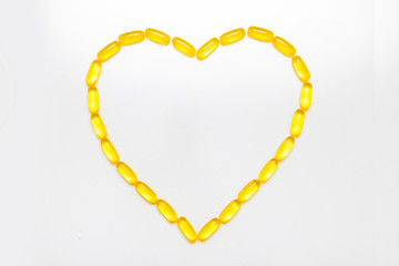 Heart shape with Omega 3 capsules