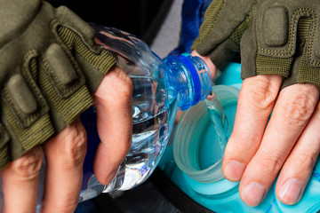 military pours water into the hydrator