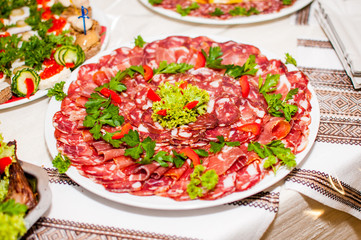 Sausages and salad decoration on the wooden table