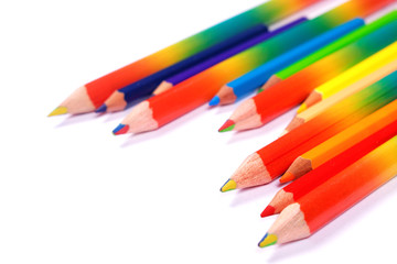 Many bright colorful pencils on white background