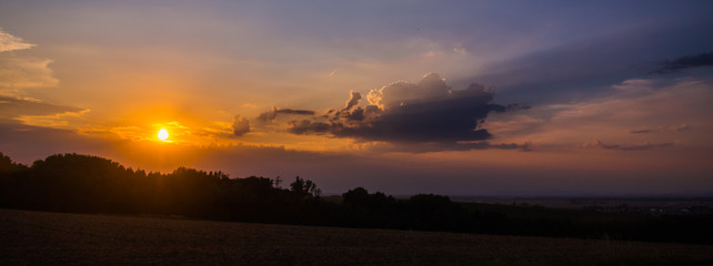 Fototapeta na wymiar Beautiful sunset with spectacular clouds near Ramsdorf - Bavaria - Germany