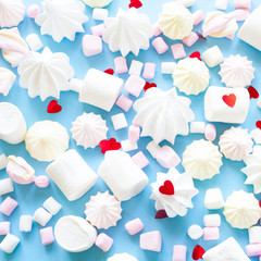 various pastel marshmallows on a blue background