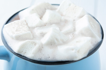 hot cocoa or coffee with marshmallow closeup