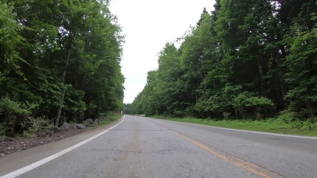 4K Point of view car driving through highway mountain in Japan