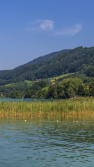 Fototapeta na wymiar Smartphone HD wallpaper of beautiful alpine view at the Mondsee - Salzburg - Austria