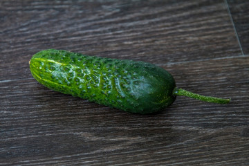ripe cucumber lies on the table