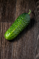 ripe cucumber lies on the table
