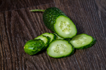 ripe cucumber lies on the table