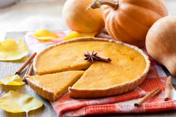 Homemade spicy pumpkin pie with cinnamon