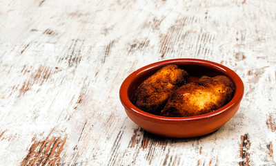 Croquettes surrounded by rustic background