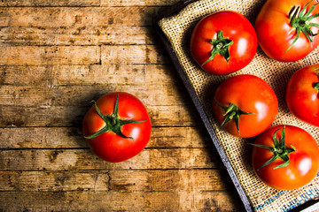 Tomatoes on a rustic wooden table