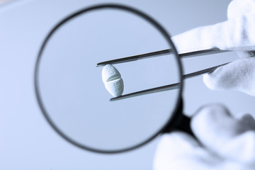 tablet under a magnifying glass