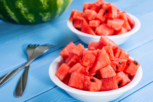 Fresh Watermelon Cut Into Cubes On Plates.