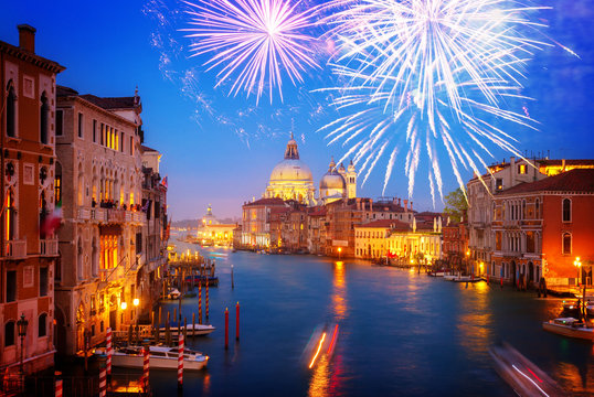 Grand canal and Basilica Santa Maria della Salute at night with fireworks, Venice, Italy, toned