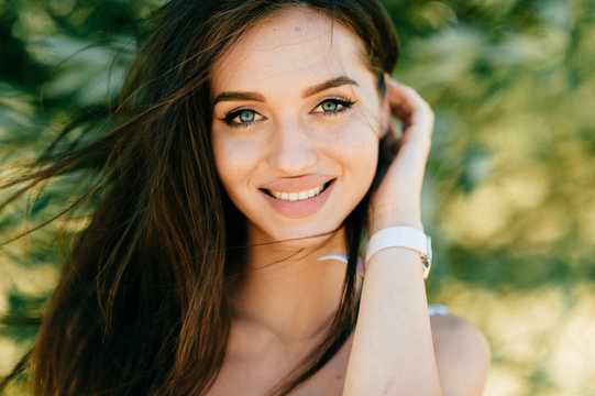 Closeup lifestyle portrait of celebrity female model.  Beautiful girl face on abstract nature background. Cheerful amazing young woman face expression. Sexy blue eyed babe. Glamour youth appearance.