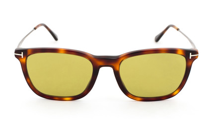 Fototapeta premium Yellow glasses with leopard print on a white background