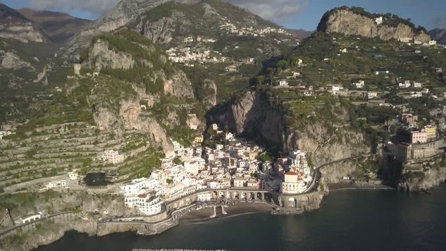 Town nestled in scenic Amalfi Coast mountains, aerial