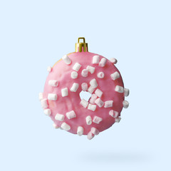 Christmas decoration made from an appetizing donut. Creative concept.