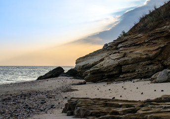 rocky seashore against the evening sky
