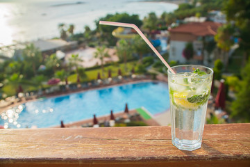 cocktail Mojito close-up on the background of the pool