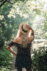 Girl in hat posing on camera