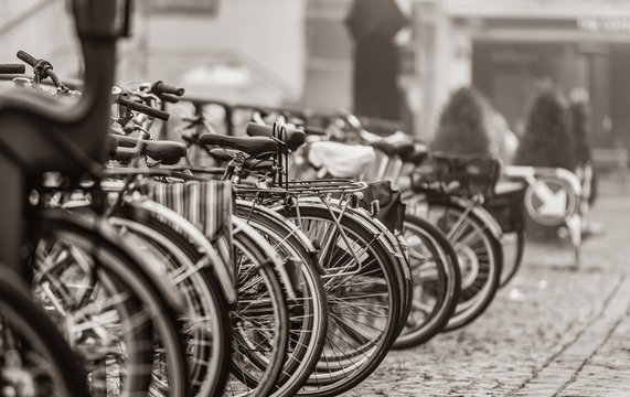 Group of bikes in parking in Amsterdam. Image in black and white color style