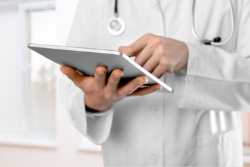 Close-up Doctor at hospital working with tablet pc