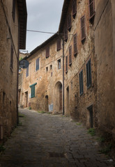 Fototapeta na wymiar View of narrow street in Italian town, Tuscany, Italy.