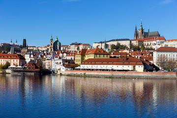 Fototapeta premium Colorful autumn Prague gothic Castle with the Lesser Town above River Vltava in the sunny Day, Czech Republic