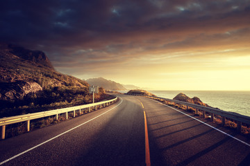 Fototapeta premium road by the sea in sunrise time, Lofoten island, Norway