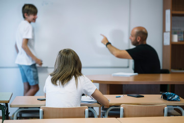 Couple young students studying at school