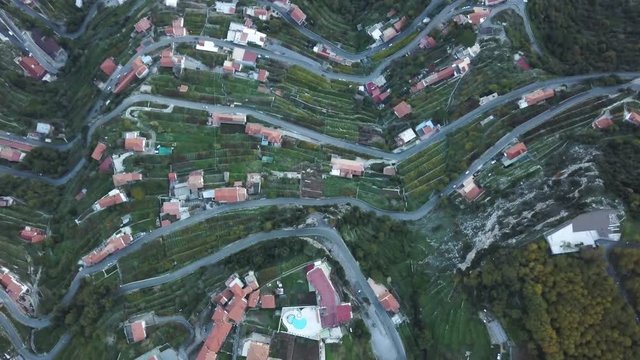 Cars drive on San Michel road, overhead aerial