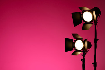 Equipment for photo studios and fashion photography. Pink copyspace, lens flare effect