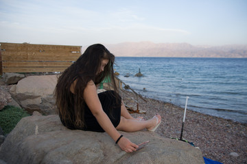 Swimsuit Concept. cute girl posing for selfie by the sea. Beautiful girls are happy.