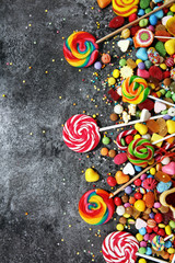 candies with jelly and sugar. colorful array of different childs sweets and treats.