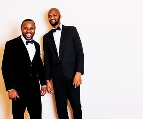 two afro-american businessmen in black suits emotional posing, g