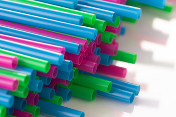 A stack of plastic drinking straws