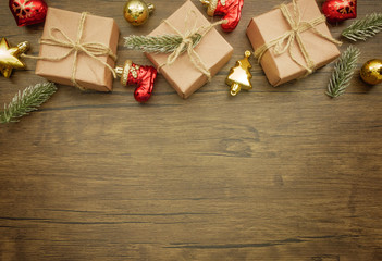 Obraz na płótnie Canvas Flat lay,top view Christmas ornaments and Christmas gifts on wooden background with copy space