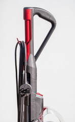 Side view of a vacuum cleaner and plug © David