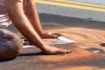 Artist drawing street art at festival in October. © john