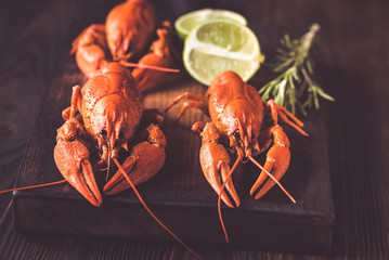 Boiled crayfish on the wooden board