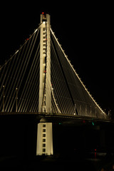 Eastside tower of the Bay Bridge at night under the lights