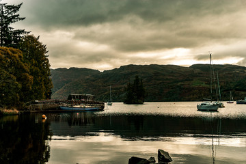 Fototapeta na wymiar tranquil boat on loch ness - Scotland