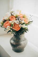 Flower bouquet in antique vase