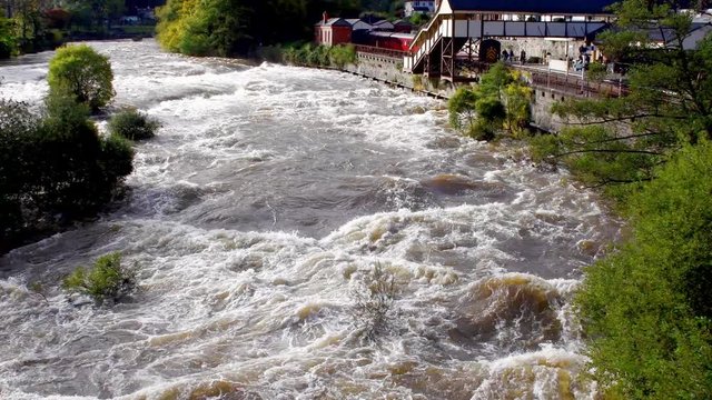 Scenic view of the river Dee at Llangollen in Wales which is swollen by recent heavy rainfall. 