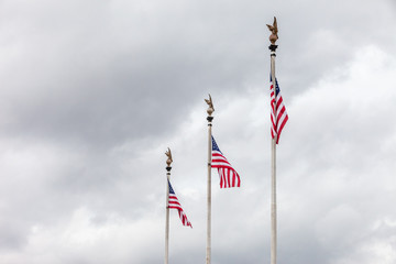 Three American Flags on Eagle Flagpoles