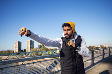 Boxer fighter practicing power punches outdoors